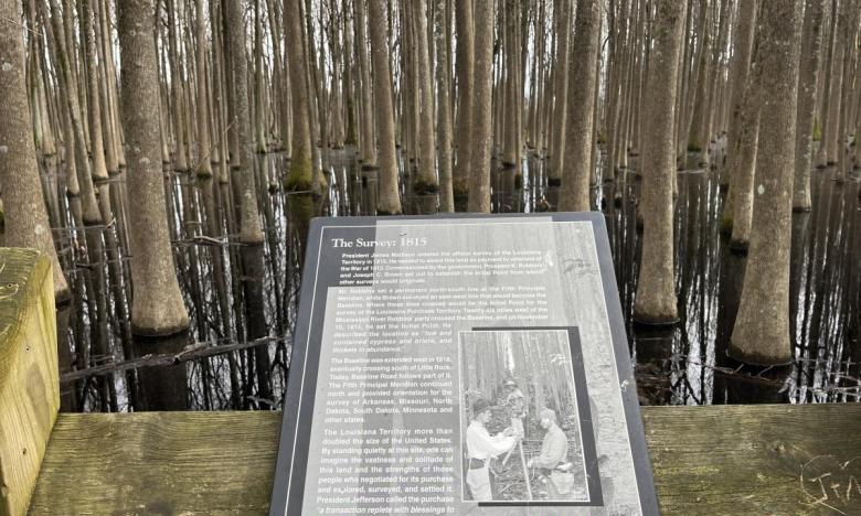 Panels along the boardwalk at Louisiana Purchase State Park provide information about the history of the location.